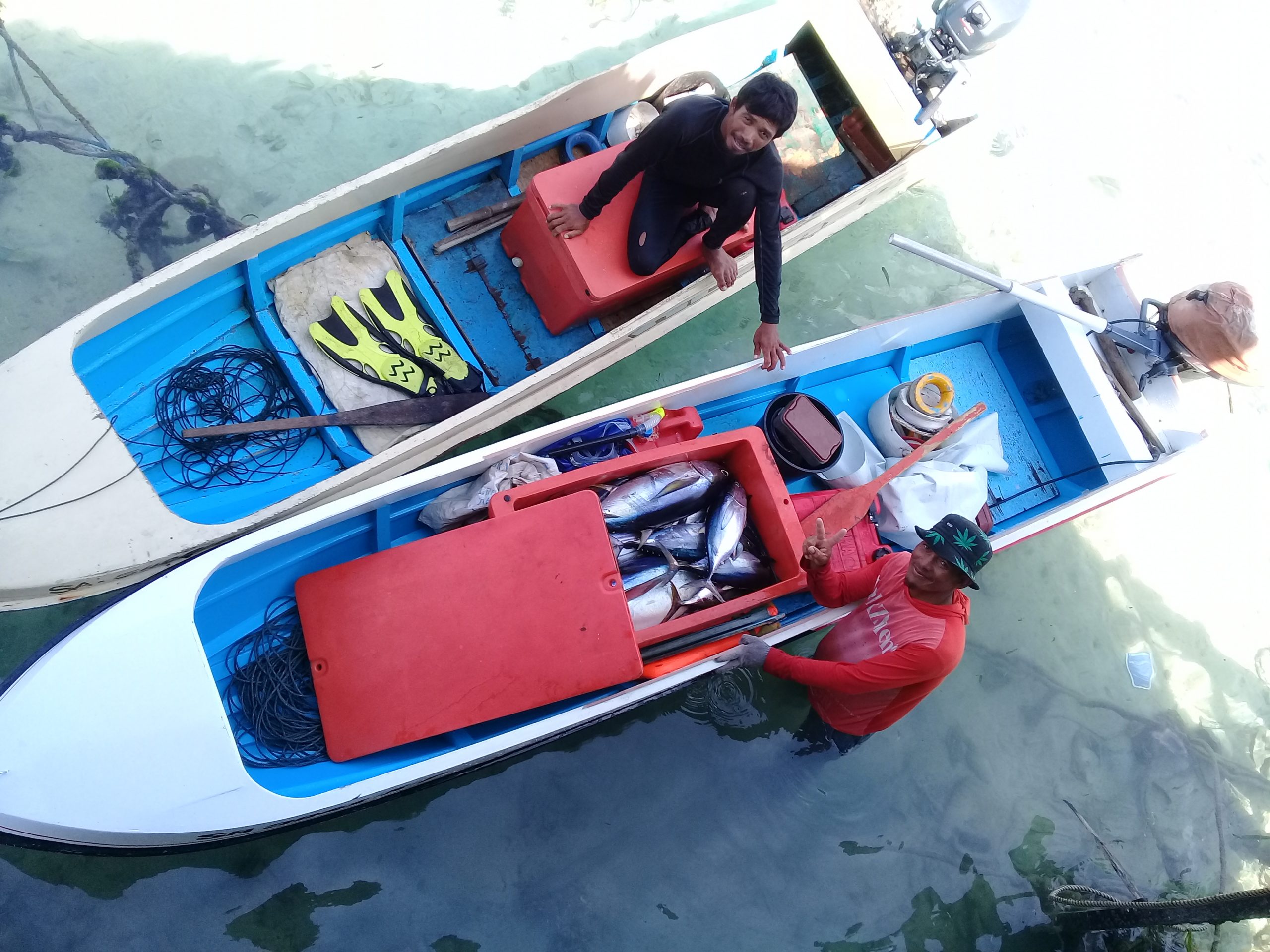 Yellowfin tuna fishermen with their catch in Mabul Island, Sabah