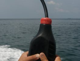 A makeshift bottle containing sodium cyanide mixture, used for cyanide fishing.